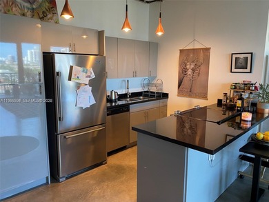 Live the ultimate Miami loft lifestyle in this expansive 2BR/2BA