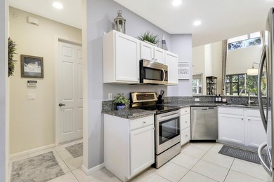 ENJOY GOLF VIEWS FROM THIS NICELY UPDATED TOWNHOUSE IN THE - photo 6