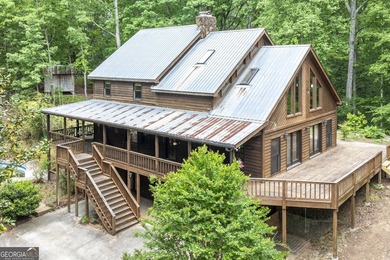 Tucked away on 5 private acres in the beautiful North Georgia - photo 3