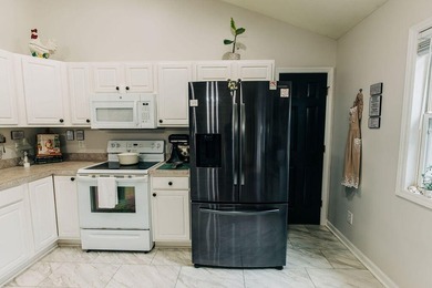Welcome to this charming 3-bedroom, 2-bathroom home featuring a - photo 13