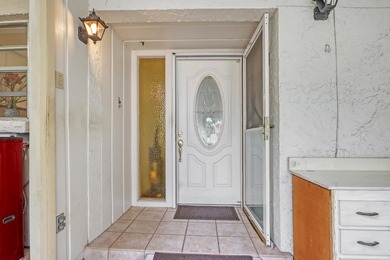 Step into this inviting two-bedroom, two-bathroom condo, where - photo 2