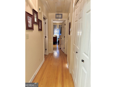 Charming, solid all-brick 2BR/1BA home tucked away on one of