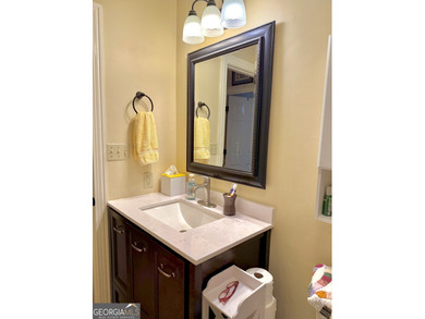 Charming, solid all-brick 2BR/1BA home tucked away on one of