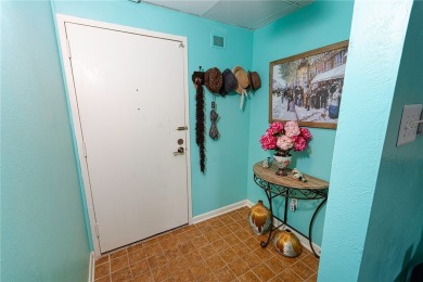 Very well-kept condo 2- bedroom 2 bath 2 cover parking garage on