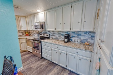 Very well-kept condo 2- bedroom 2 bath 2 cover parking garage on