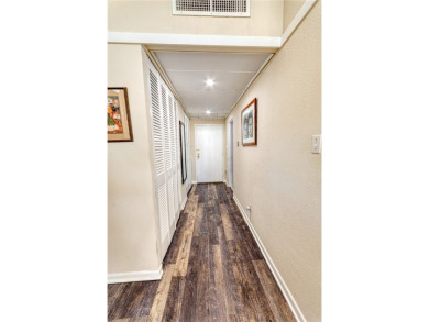 Very well-kept condo 2- bedroom 2 bath 2 cover parking garage on