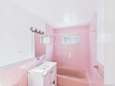 Semi-detached two-family home located in the Allerton section of - photo 16