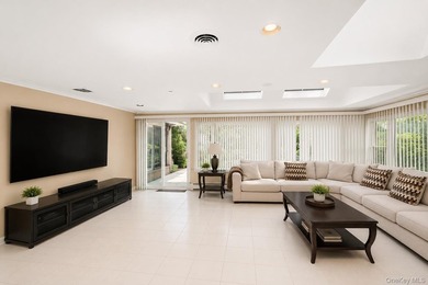 Welcome to this exceptional Hewlett residence, where timeless - photo 11
