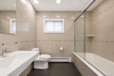 Welcome to this exceptional Hewlett residence, where timeless - photo 17