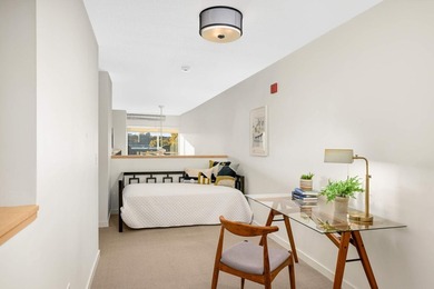 This stylish two story loft offers modern living with all the - photo 22