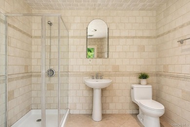 Welcome to this exceptional Hewlett residence, where timeless - photo 24
