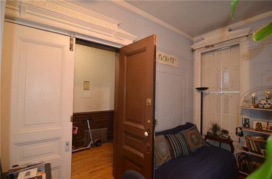 Welcome to this charming three-family brownstone, ideally - photo 15