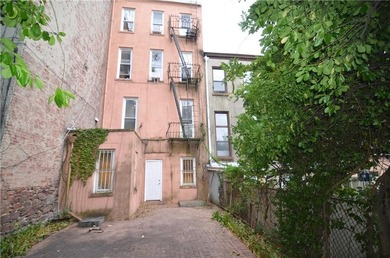 Welcome to this charming three-family brownstone, ideally - photo 22