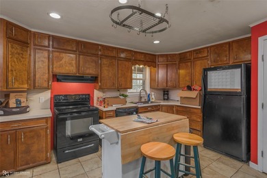 This spacious four-bedroom, two-bath home offers room to spread - photo 6