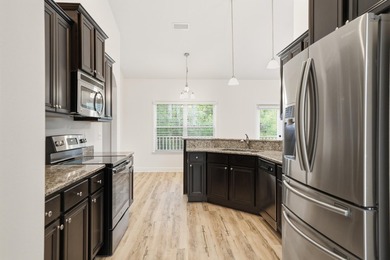 Set on a huge 0.52 acre lot with peaceful forest views, this - photo 17