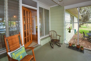 Welcome to Old Florida! Stepping onto the screened porch is like - photo 11