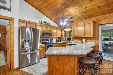 Nestled within the exclusive gated Lake Rhodhiss community of - photo 11