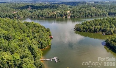 Nestled within the exclusive gated Lake Rhodhiss community of - photo 42