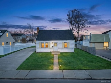 Introducing this charming and spacious Cape-style home featuring - photo 1