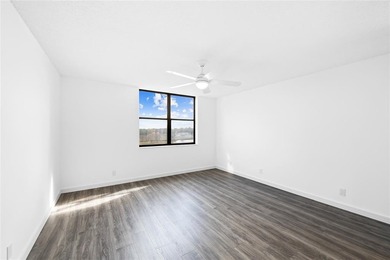 Ascend to the 4th floor of this 2-bed, 2-bath condo, nestled in