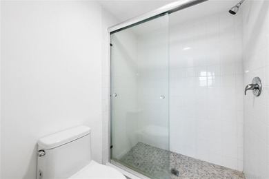 Ascend to the 4th floor of this 2-bed, 2-bath condo, nestled in