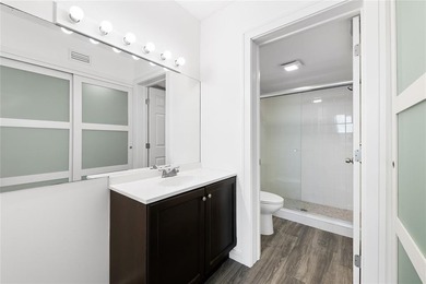 Ascend to the 4th floor of this 2-bed, 2-bath condo, nestled in