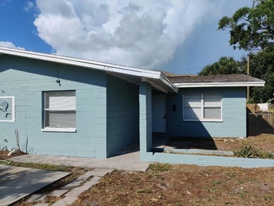 This solid concrete block multi-family property features two - photo 1
