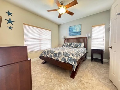 This fully furnished ground floor condo has tile floor and - photo 14