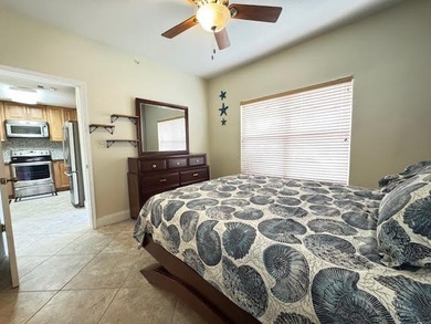 This fully furnished ground floor condo has tile floor and - photo 15