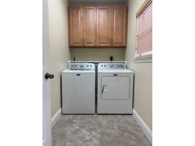 This fully furnished ground floor condo has tile floor and - photo 17