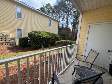 This fully furnished ground floor condo has tile floor and - photo 19