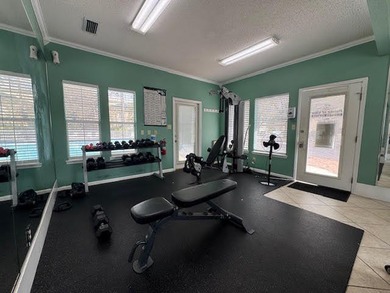 This fully furnished ground floor condo has tile floor and - photo 24