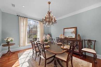 This elegant executive brick home offers luxury living and