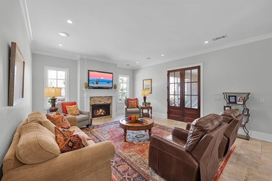 This elegant executive brick home offers luxury living and