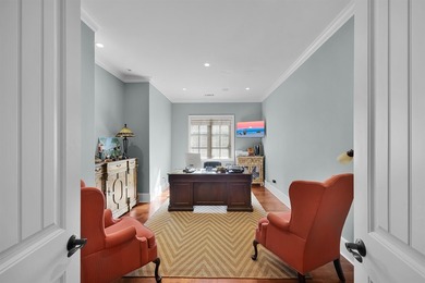 This elegant executive brick home offers luxury living and