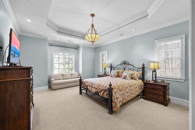 This elegant executive brick home offers luxury living and