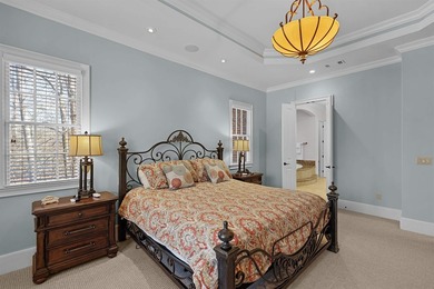 This elegant executive brick home offers luxury living and