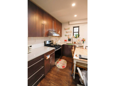 This architect-designed two-family residence is a rare offering - photo 22