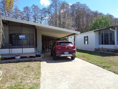 THIS IS A GREAT SIZE HOME LARGE FRONT SCREENED LANAI ALSO A SIDE - photo 3