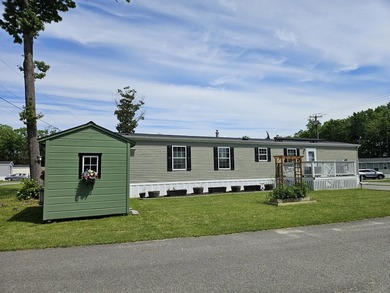 Tucked away at the end of the street in a mobile home park, this - photo 1