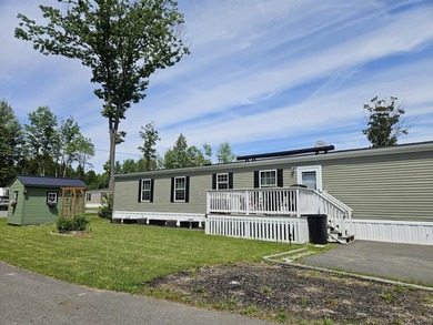 Tucked away at the end of the street in a mobile home park, this - photo 2