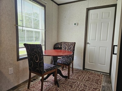 Tucked away at the end of the street in a mobile home park, this - photo 8