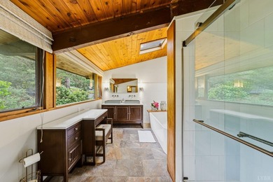 Nestled at the end of a private drive, this lakeside sanctuary - photo 9