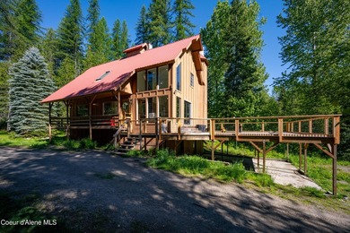 Set along 290 feet of private Upper Pack River frontage on over - photo 1