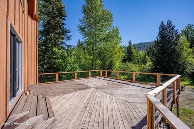 Set along 290 feet of private Upper Pack River frontage on over - photo 8