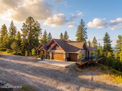 Stunning sunsets frame this custom designed Craftsman that sits - photo 10