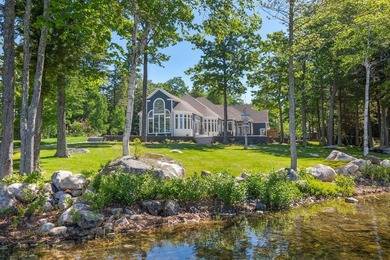 Set on a private peninsula with 600 feet of waterfront, this - photo 1