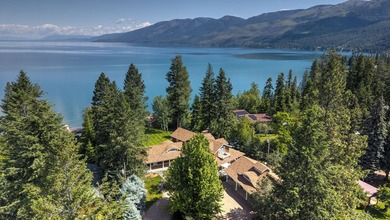 Privately gated on 3.81 acres of coveted Finley Point, this - photo 1