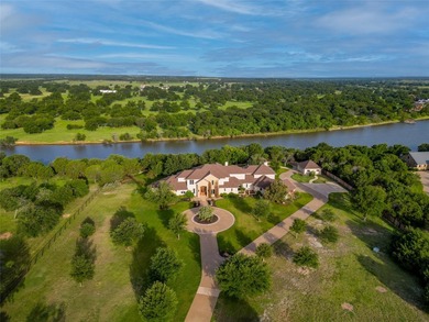 Welcome to an exceptional riverfront estate located in the - photo 1