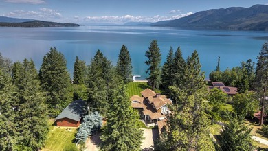 Privately gated on 3.81 acres of coveted Finley Point, this - photo 5